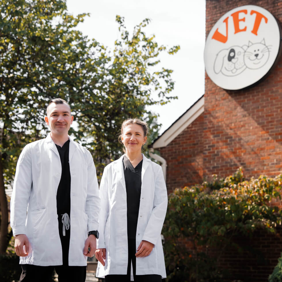 team of doctors standing outside of clinic